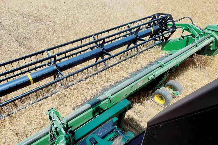Blades on this combine owned by Nick Owen cut through wheat